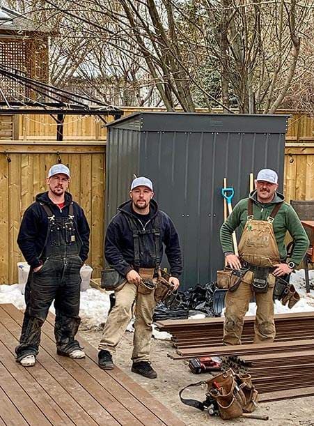 National Fence & Deck owners and team members building a deck in Calgary.