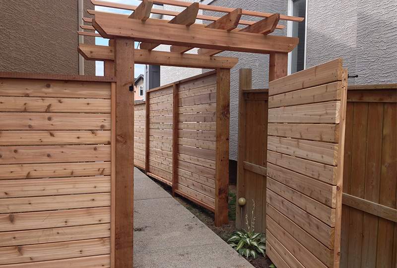 Horizontal Cedar Fence With Custom Gate Arbor National Fence Deck Quality Deck Builder Calgary Ab Horizontal Cedar Fence With Custom Gate Arbor National Fence Deck Quality Deck Builder Calgary Ab