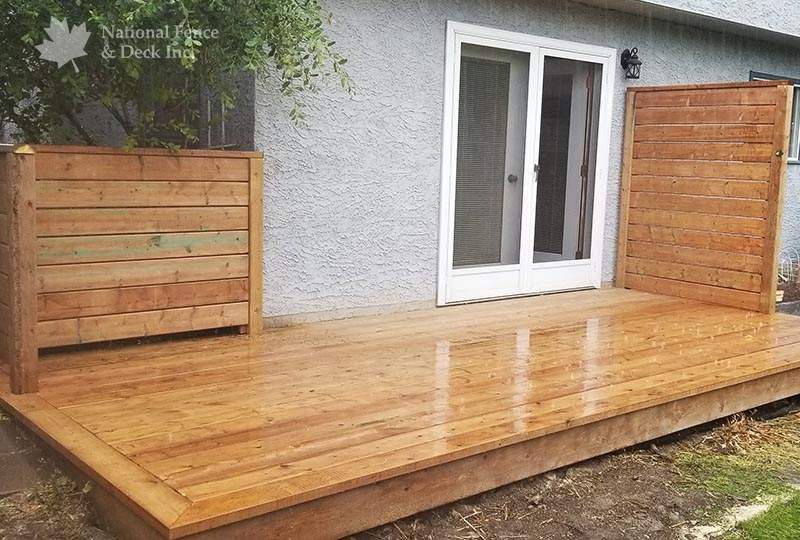 Ground level brown pressure treated deck