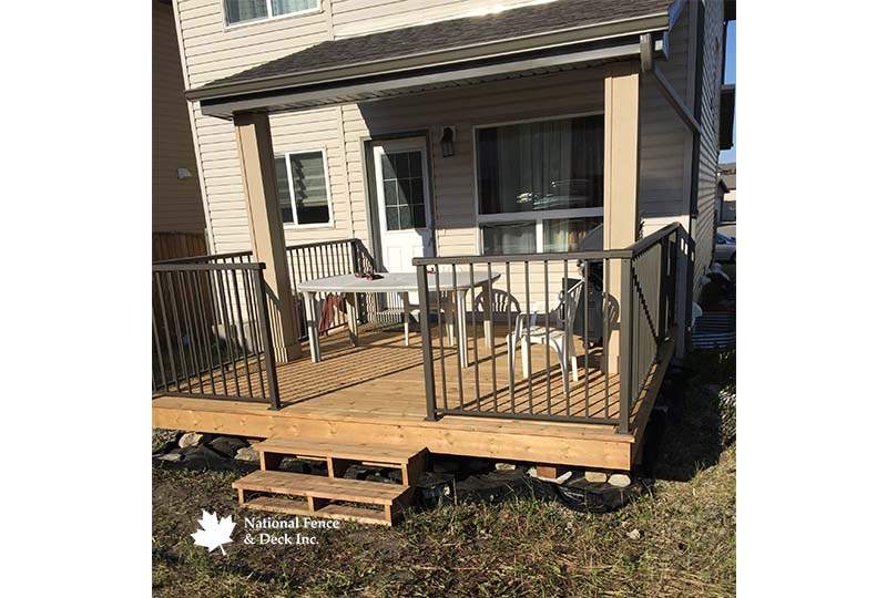 Brown Pressure Treated Deck With Bronze Aluminum Rail