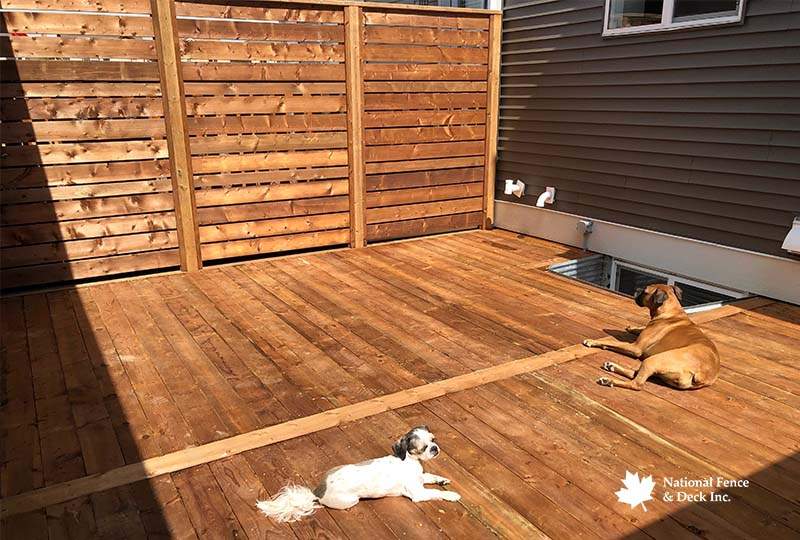 Deck Featuring A Matching Wood Privacy Wall