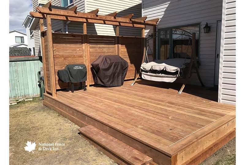 Pressure Treated Deck With A Pergola Structure