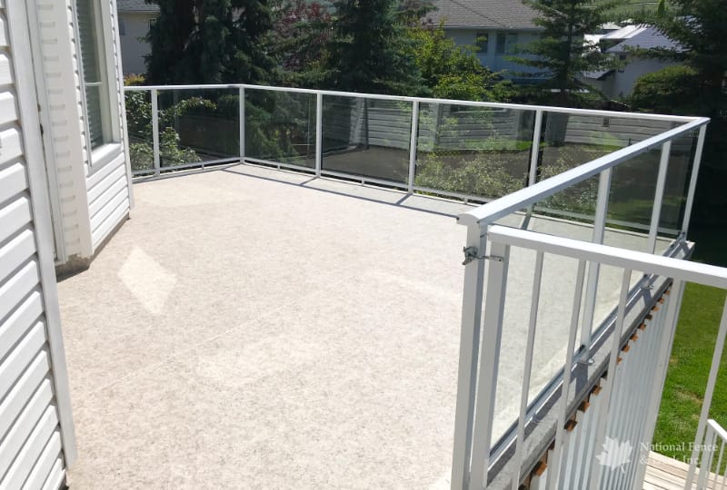 Walk-out DekSmart vinyl deck with white clear glass aluminum railings
